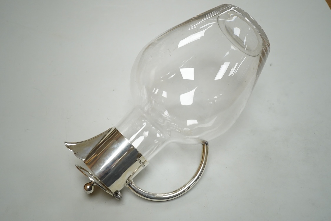 A late Victorian silver mounted glass claret jug, by John Newton Mappin, Sheffield, 1886, with engraved crest and anniversary dates, height 25.5cm.